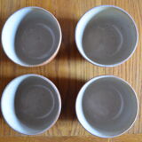 Lot of 4 bowls in sandstone and shiny grey inside