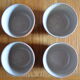 Lot of 4 bowls in sandstone and shiny grey inside