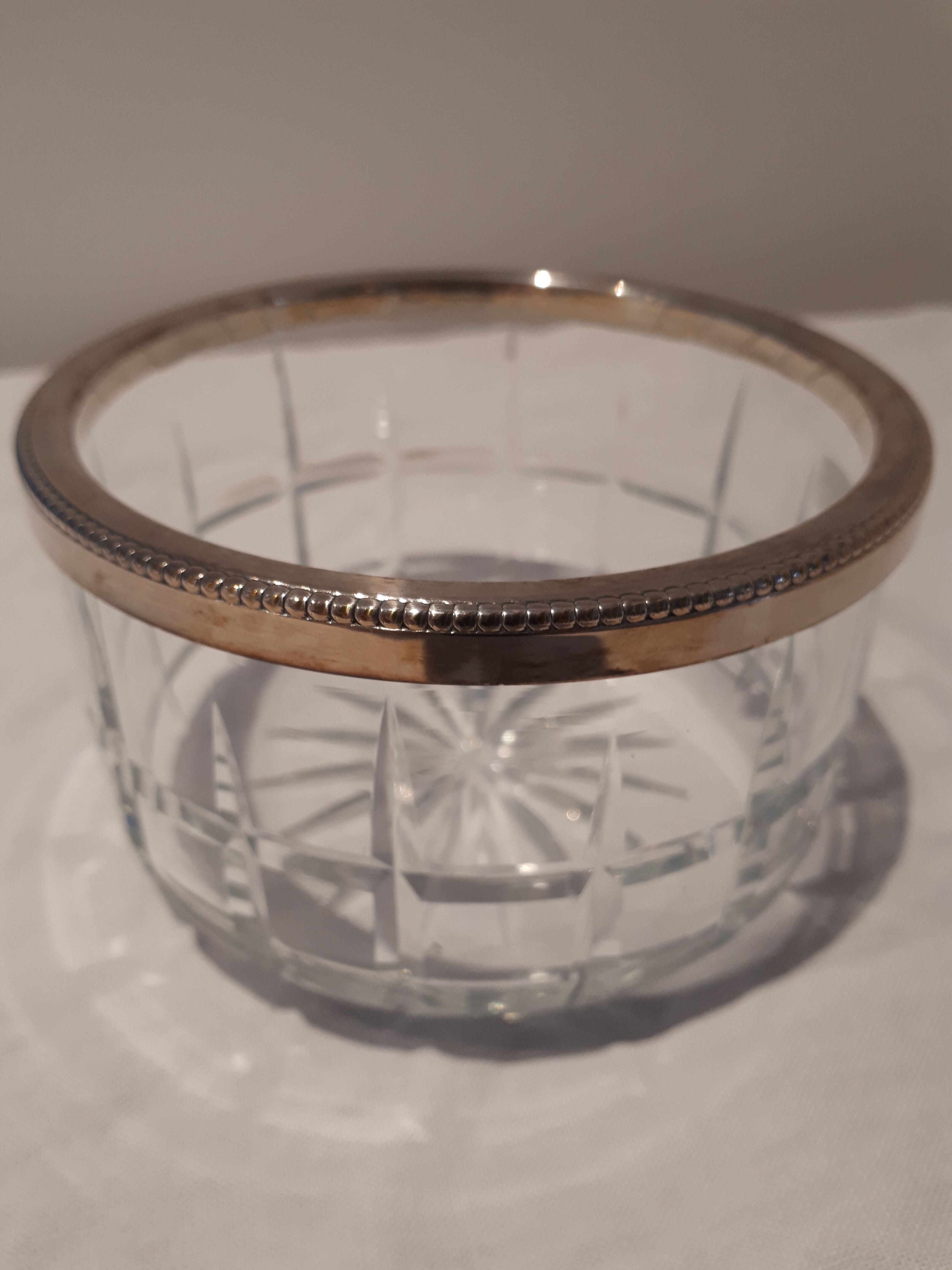 Glass and silver metal cup