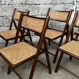 Serie de 8 chaises pliantes vintage en bois et cannage 1960