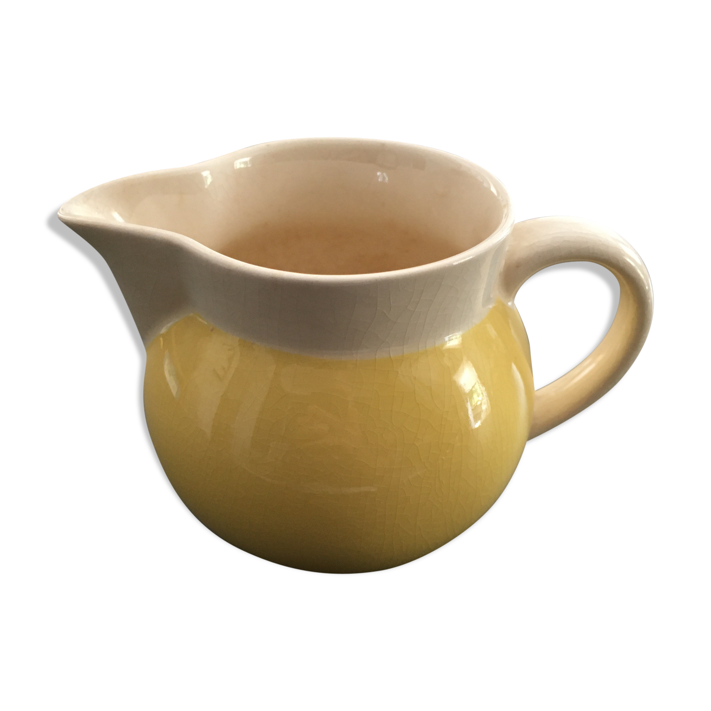 Yellow straw and ivory pitcher