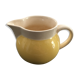 Yellow straw and ivory pitcher