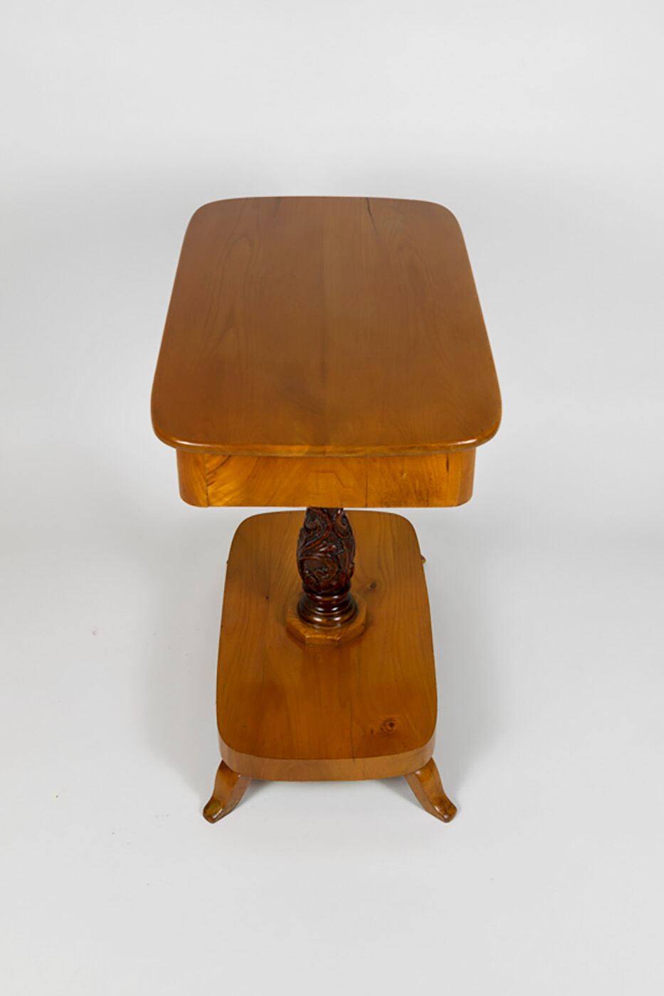 Danish Biedermeier elm occasional table with carved base and drawer