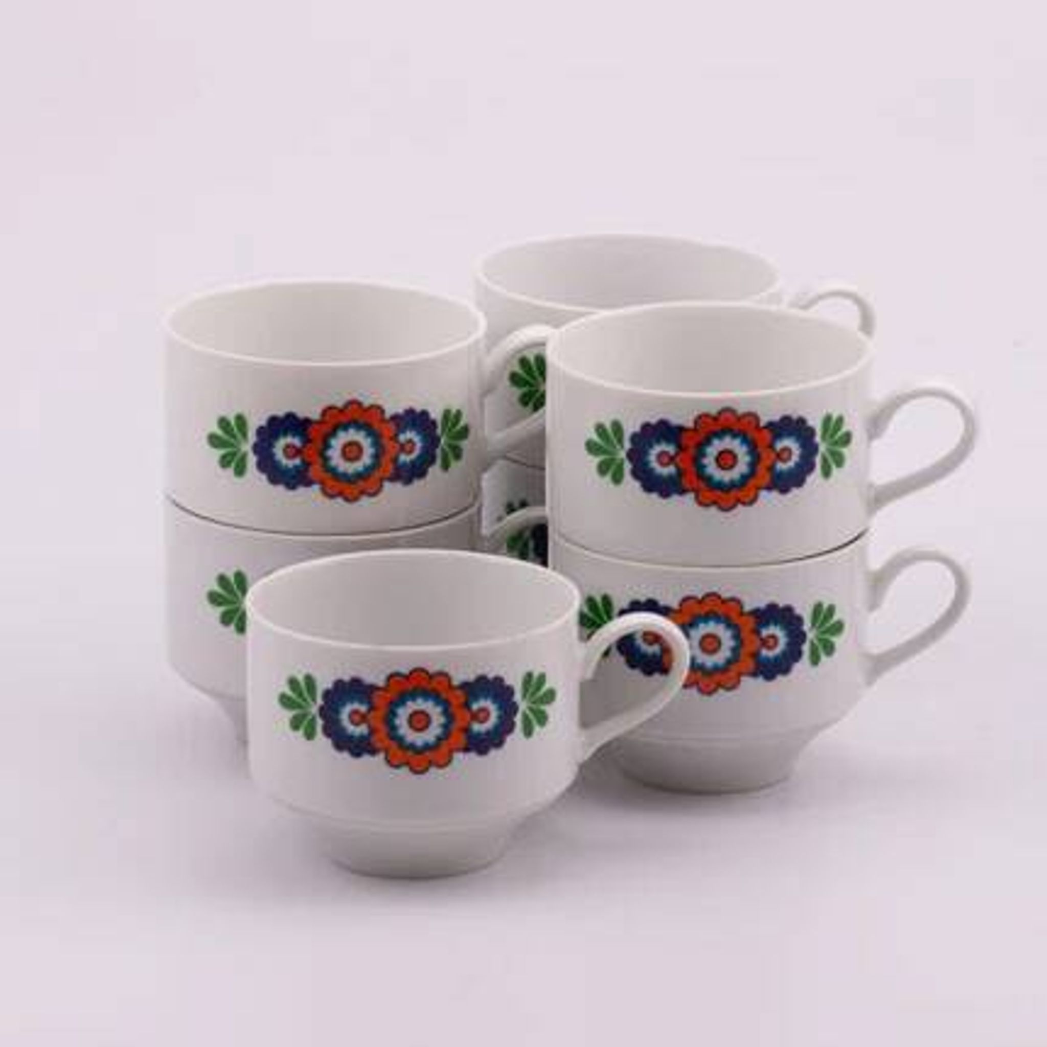 7 white porcelain cups from Winterling with coloured patterns.