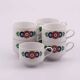 7 white porcelain cups from Winterling with coloured patterns.