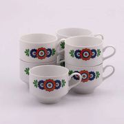 7 white porcelain cups from Winterling with coloured patterns.