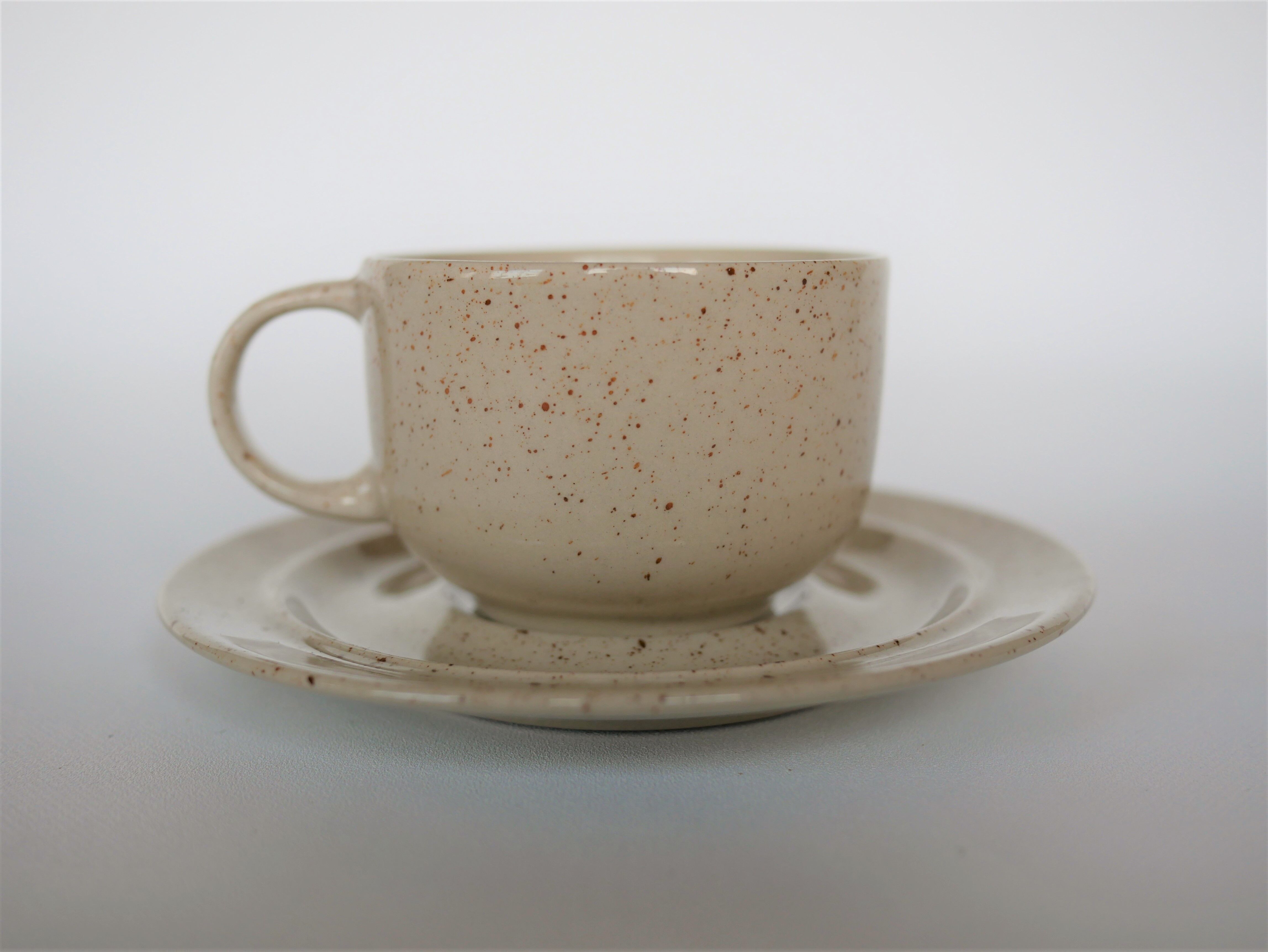 Coffee cup and vintage pyrity sandstone subcup