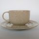 Coffee cup and vintage pyrity sandstone subcup