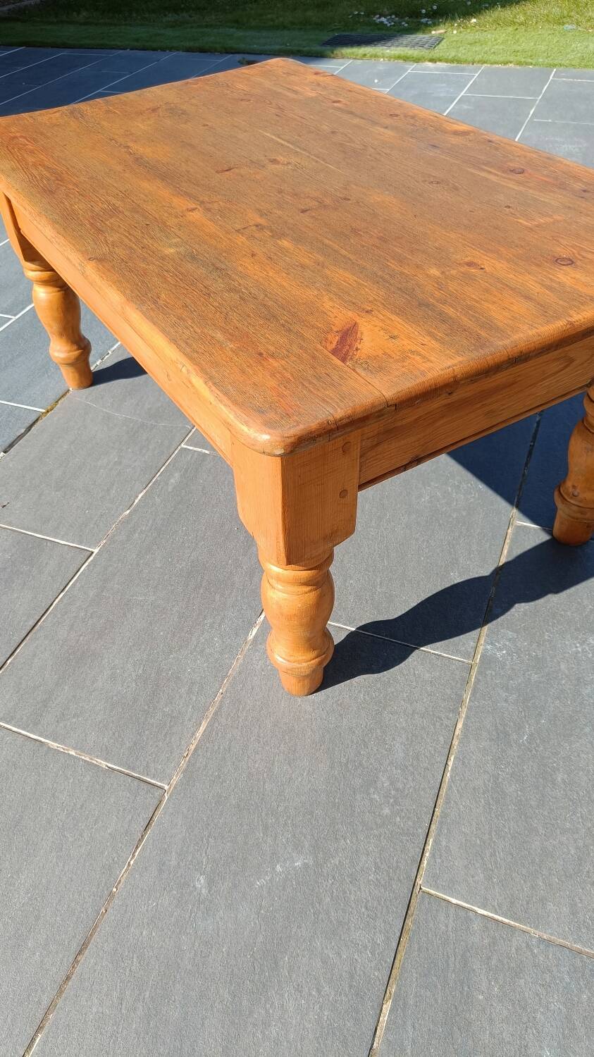 Solid oak coffee table with turned legs.