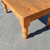 Solid oak coffee table with turned legs.