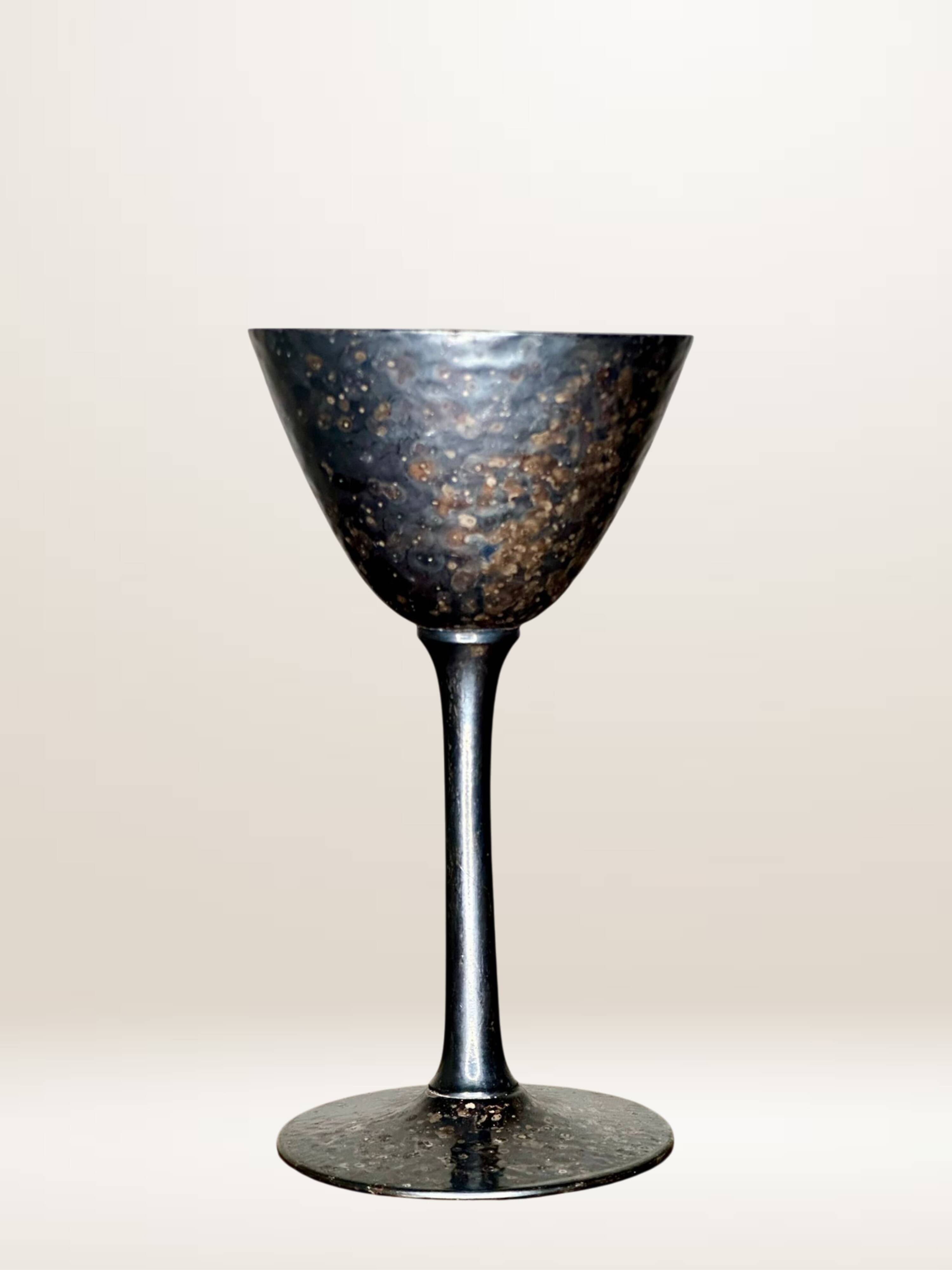 Set of six hammered metal goblets.
