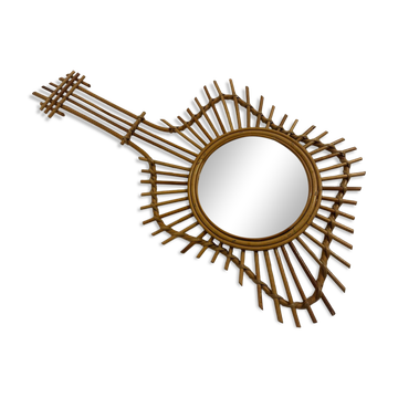 The vintage guitar rattan mirror.