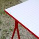 Desk with red trestles, white plaid tray, 80s