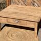 Large square farmhouse coffee table made of raw solid oak.
