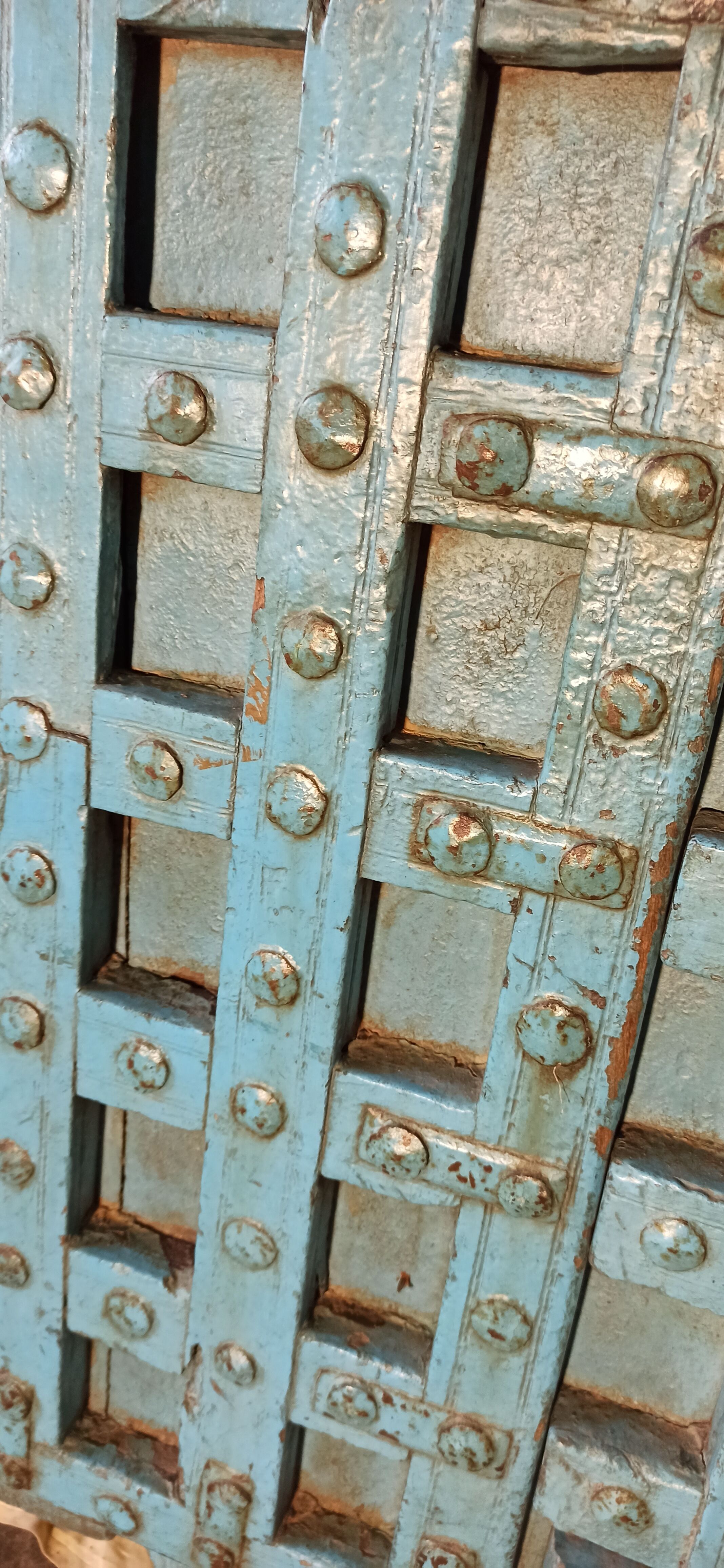 Old blue wooden door with braces