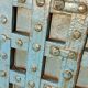 Old blue wooden door with braces