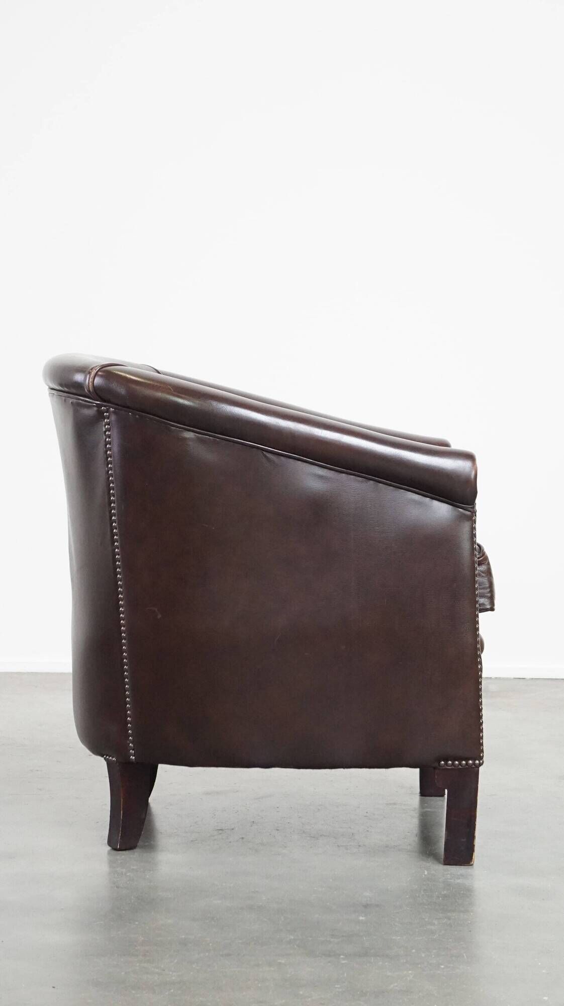 dark cowhide club chair in English style