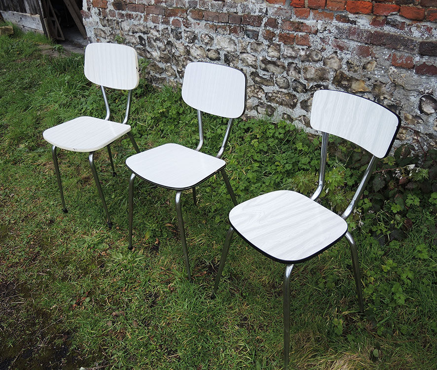 3 old white Formica chairs