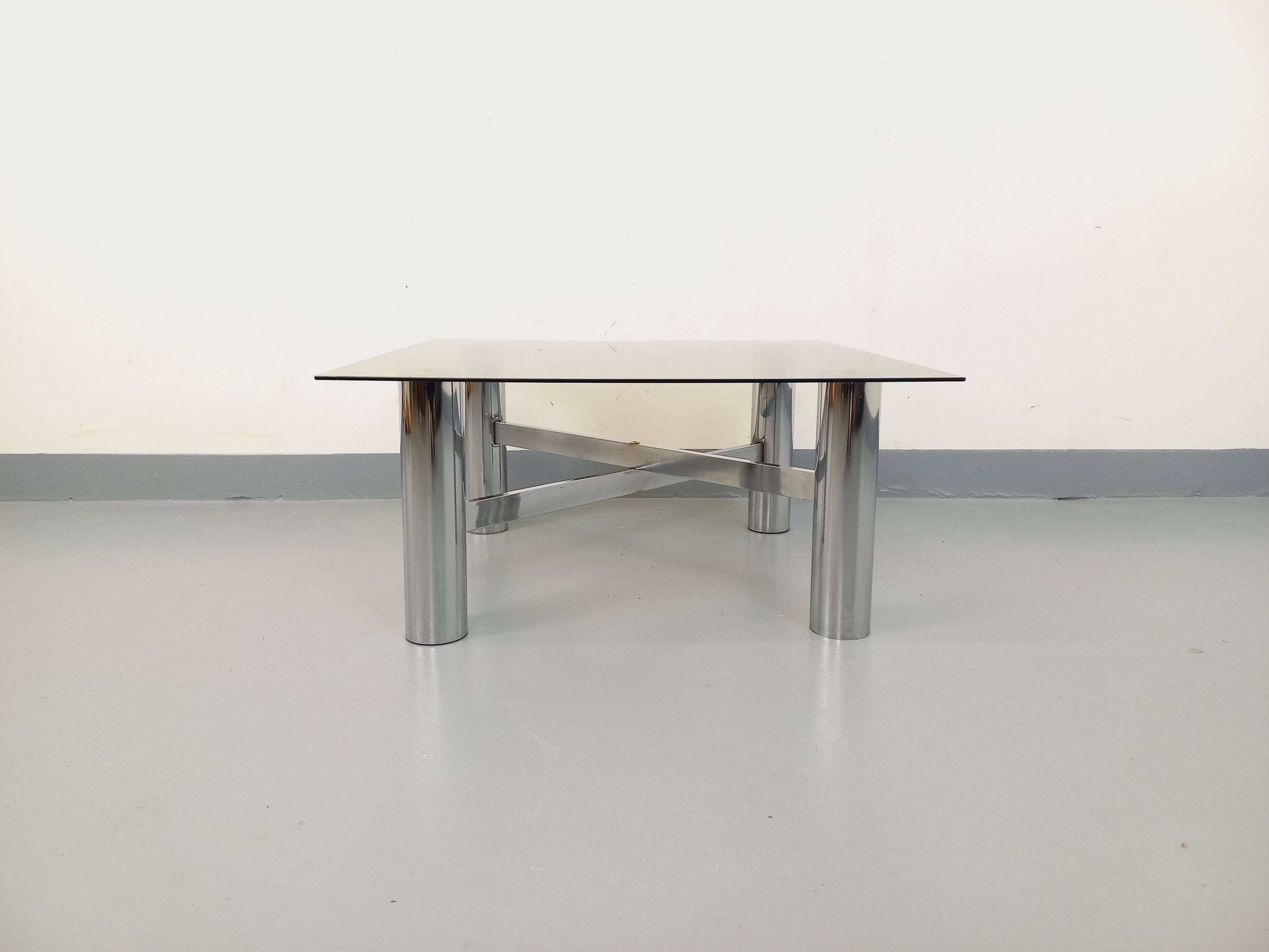 Square Italian vintage Space Age coffee table in smoked glass and metal.