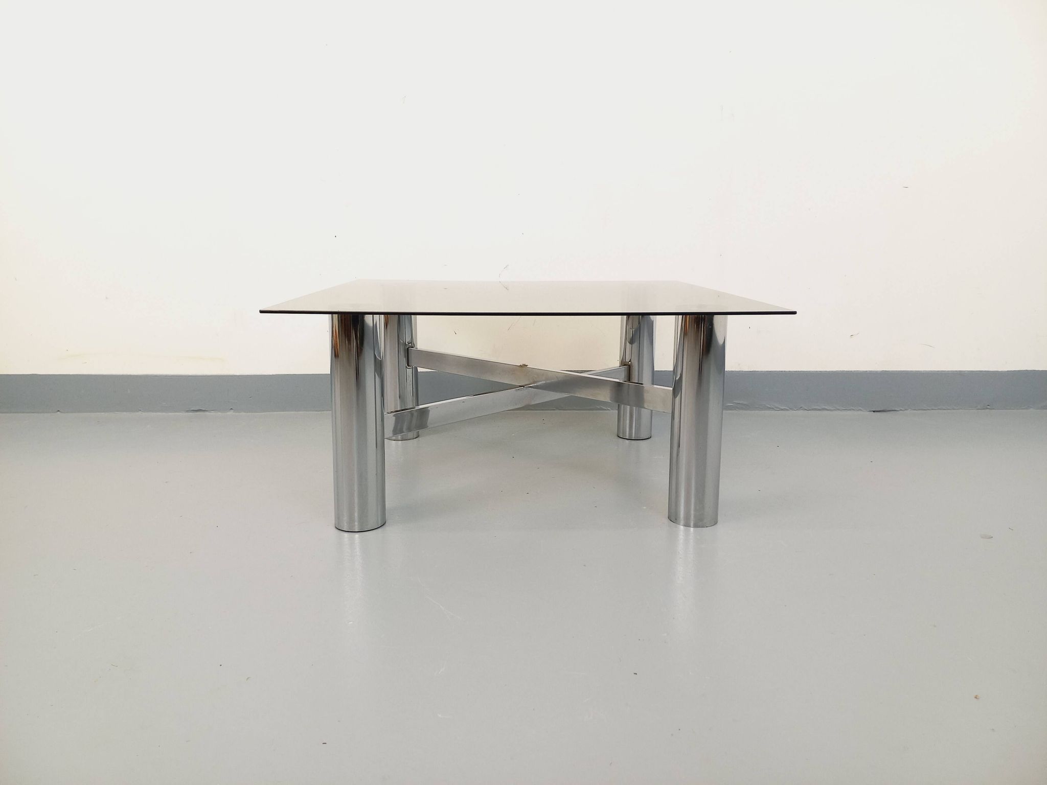 Square Italian vintage Space Age coffee table in smoked glass and metal.