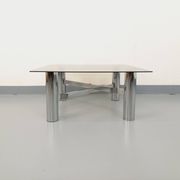 Square Italian vintage Space Age coffee table in smoked glass and metal.