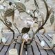 Italian cage chandelier decorated with ceramic roses and glass paste pendants