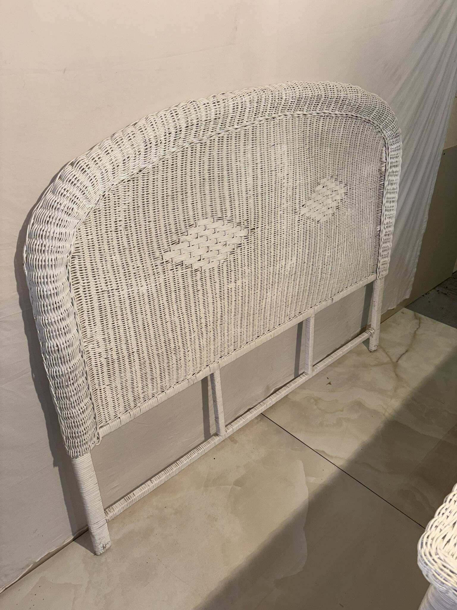 Vintage headboard in woven white rattan