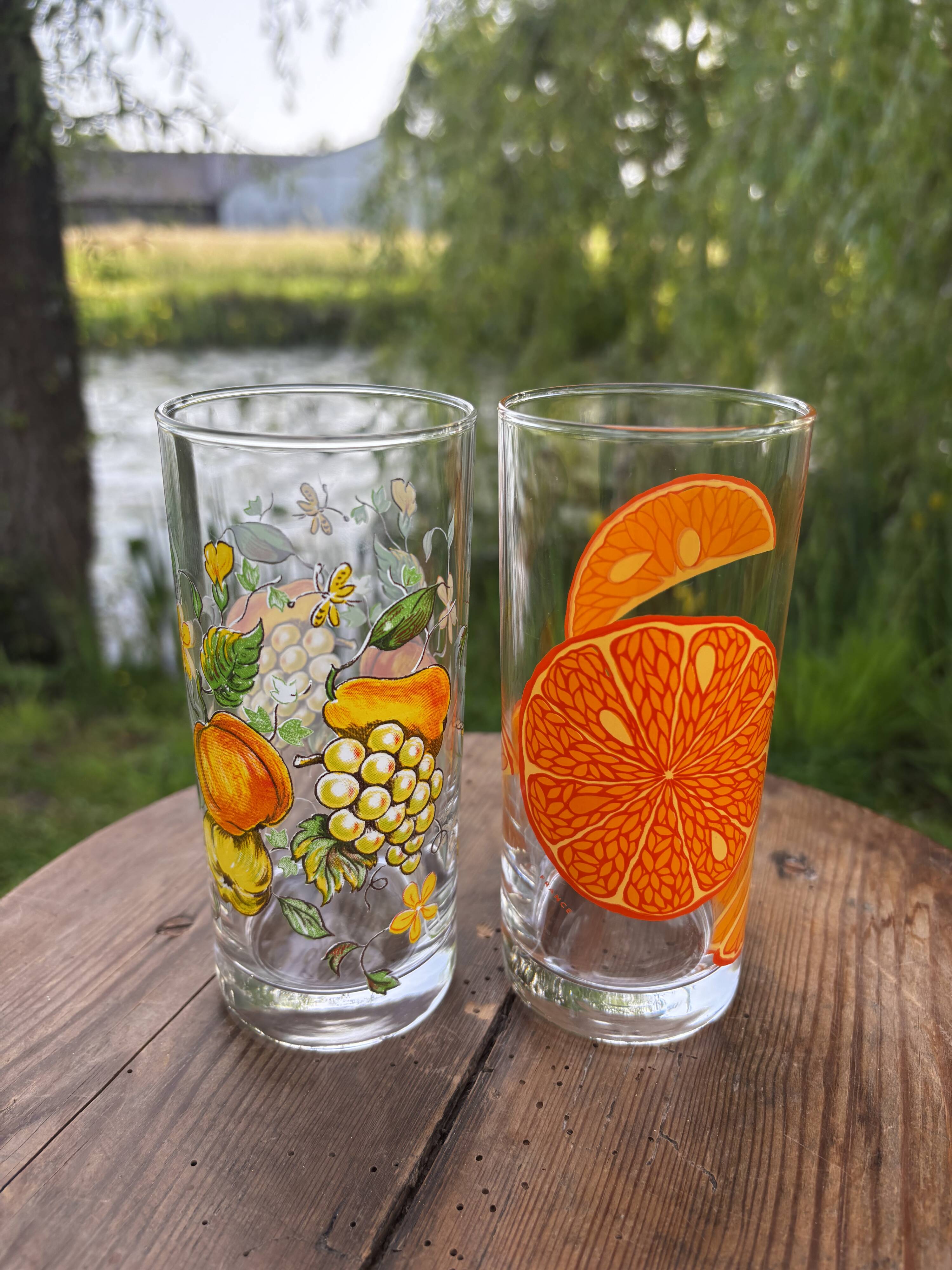 Vintage set of 4 fruit-decorated orangeade glasses.
