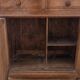 Antique wooden chest of drawers with a marble top.