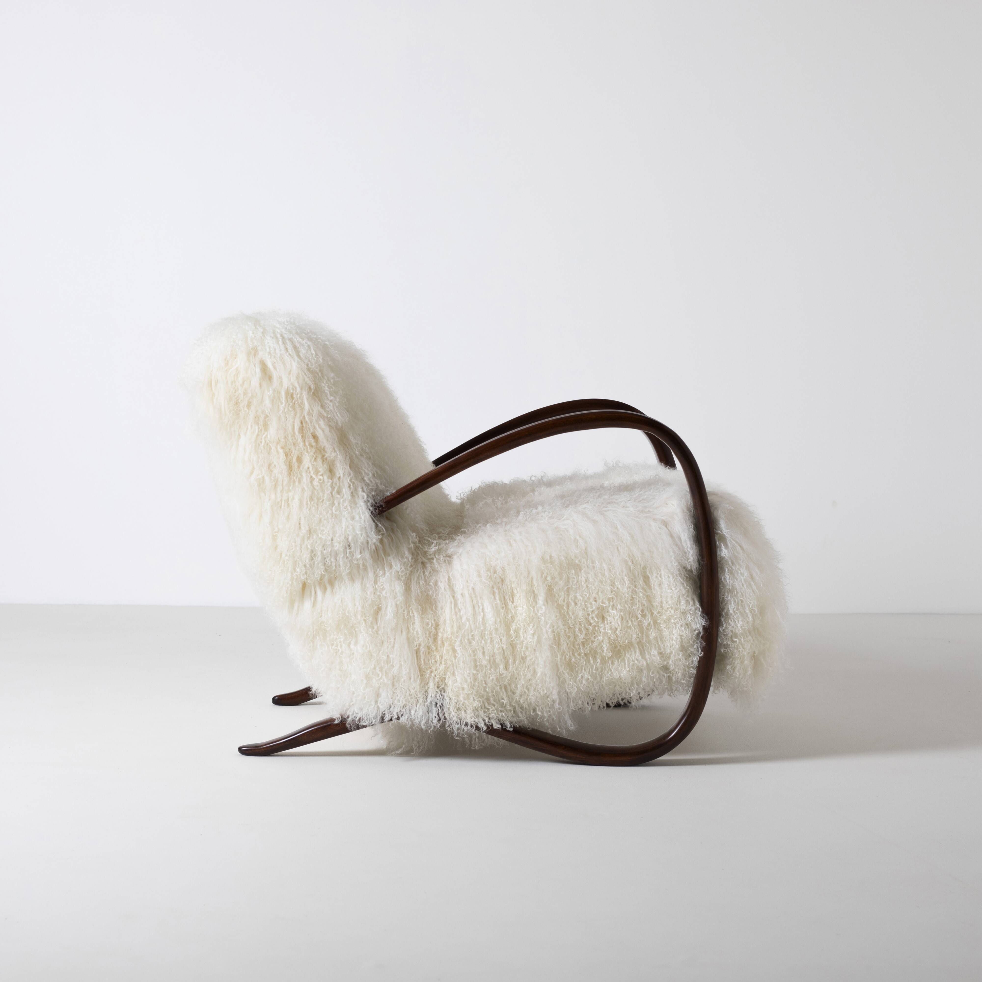 Pair of Jindrich Halabala H 269 lounge chairs in mongolian sheepskin