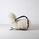 Pair of Jindrich Halabala H 269 lounge chairs in mongolian sheepskin