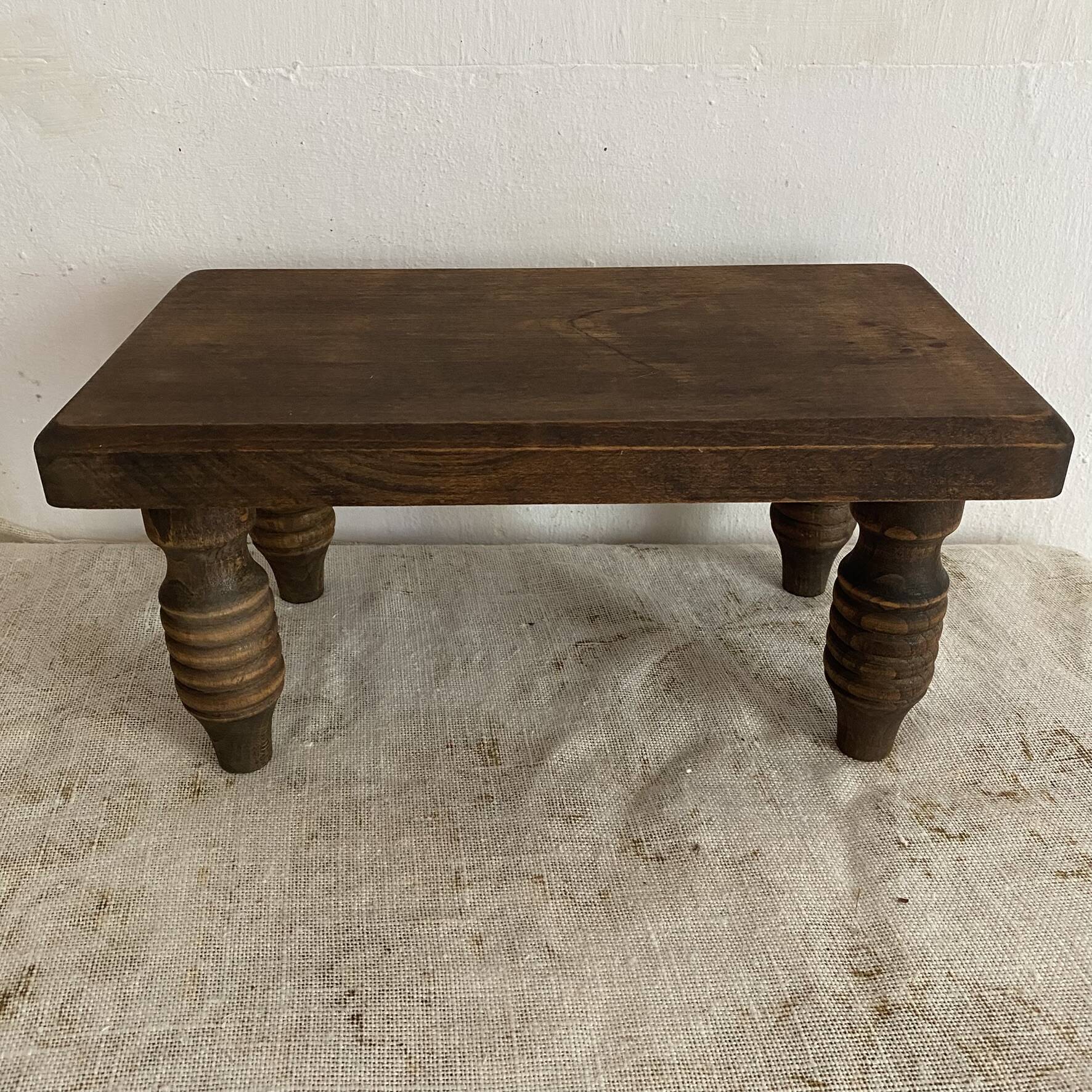 Low stool, turned wooden legs.