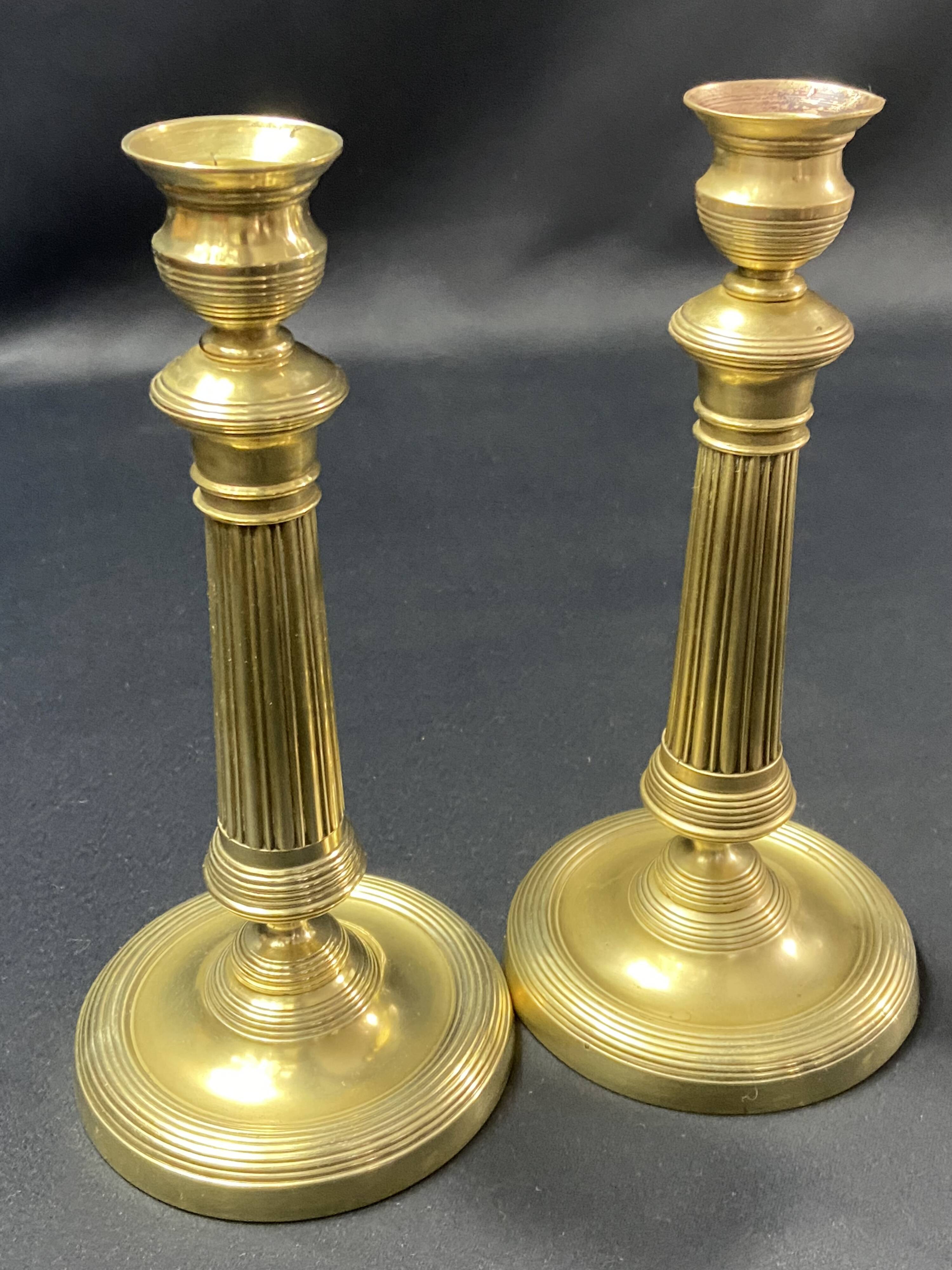 Pair of 19th century gilt bronze candlesticks with fluted shafts, Restoration