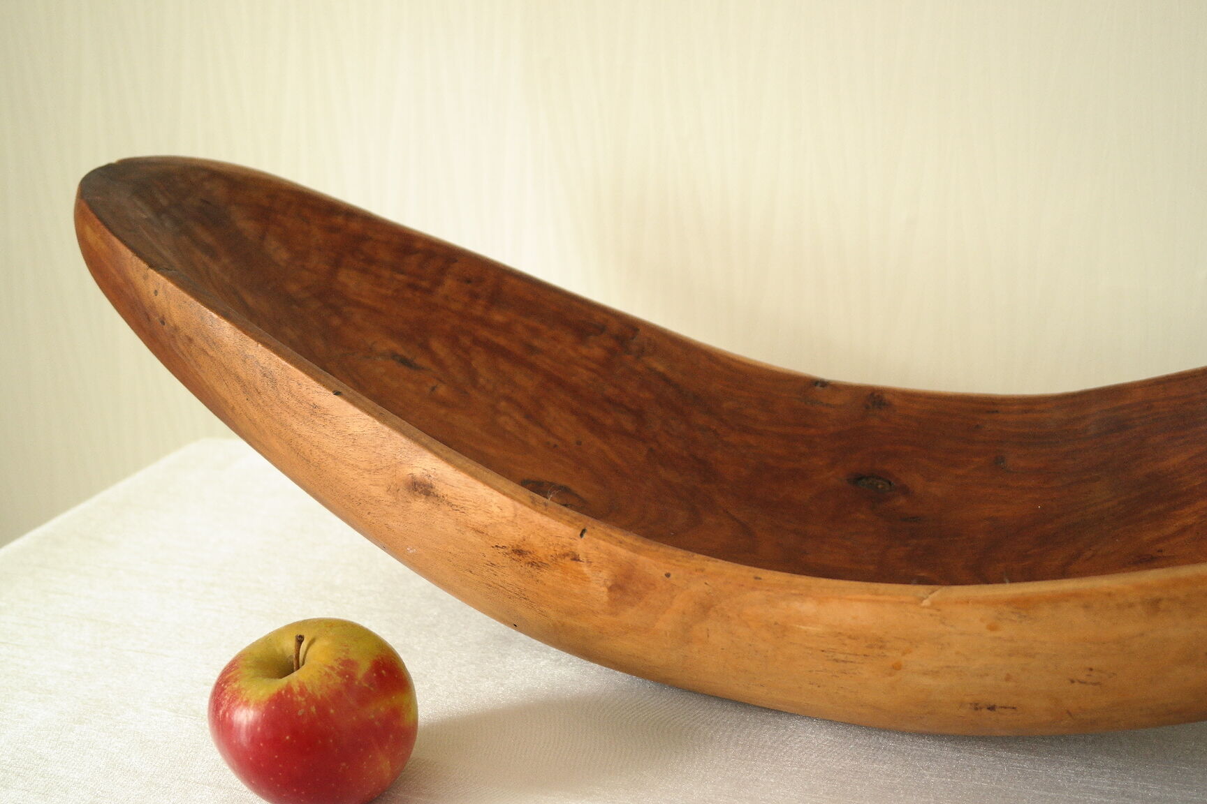 Brutalistic cut in exotic wood boomerang shape