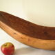 Brutalistic cut in exotic wood boomerang shape
