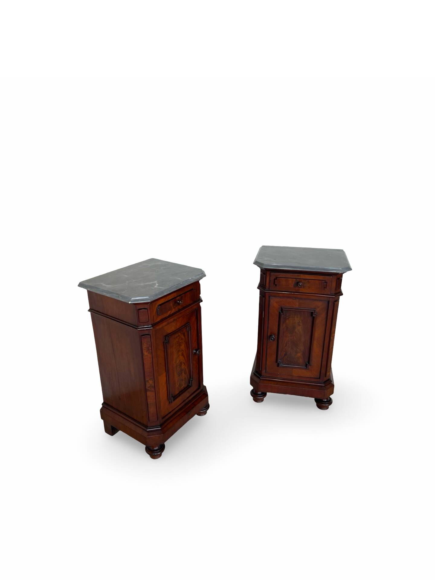 A pair of antique walnut bedside tables from the 1890s.