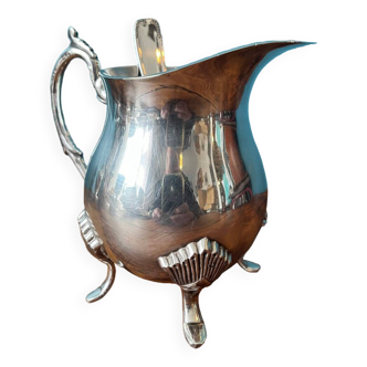 Milk jug creamer with silver metal ladle