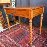 Small solid wood desk with a drawer.