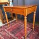 Small solid wood desk with a drawer.