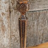 Pair of chiseled metal candle holders