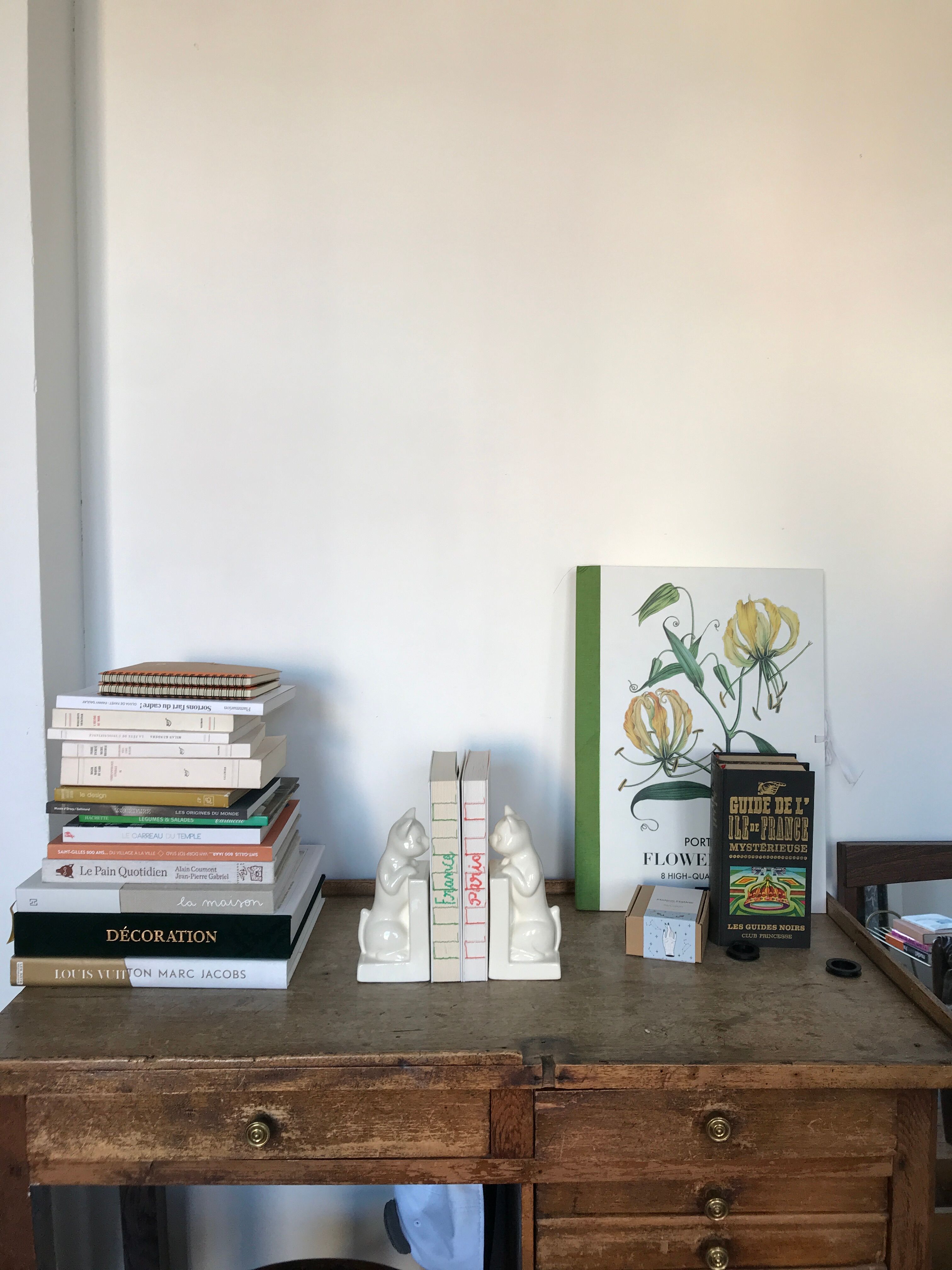 Pair of greenhouses book cat