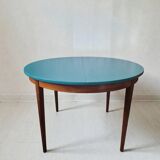 Extendable oval teak dining table