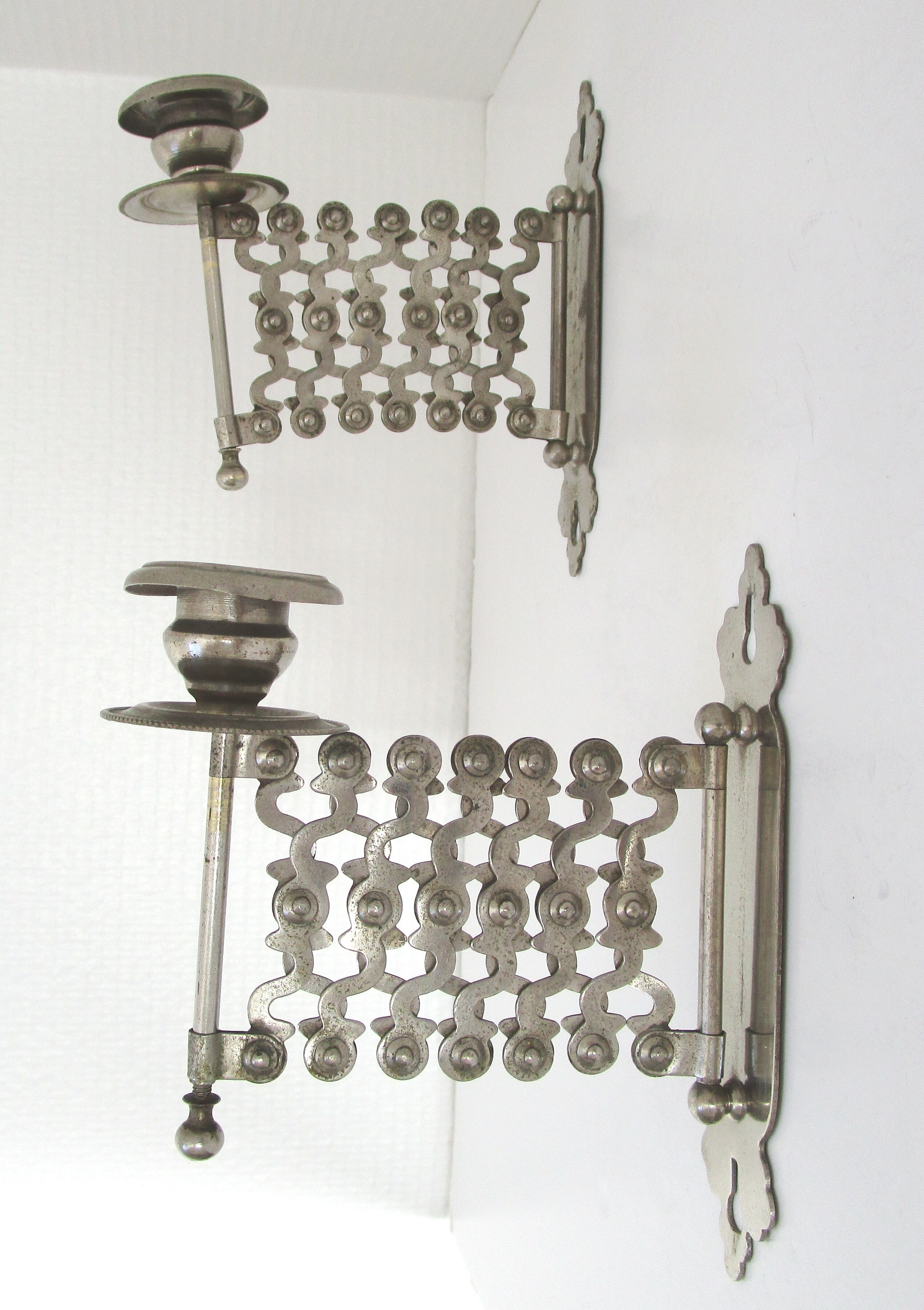 Pair of extendable old metal candlesticks