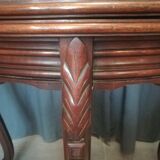 Half-moon mahogany game table on casters