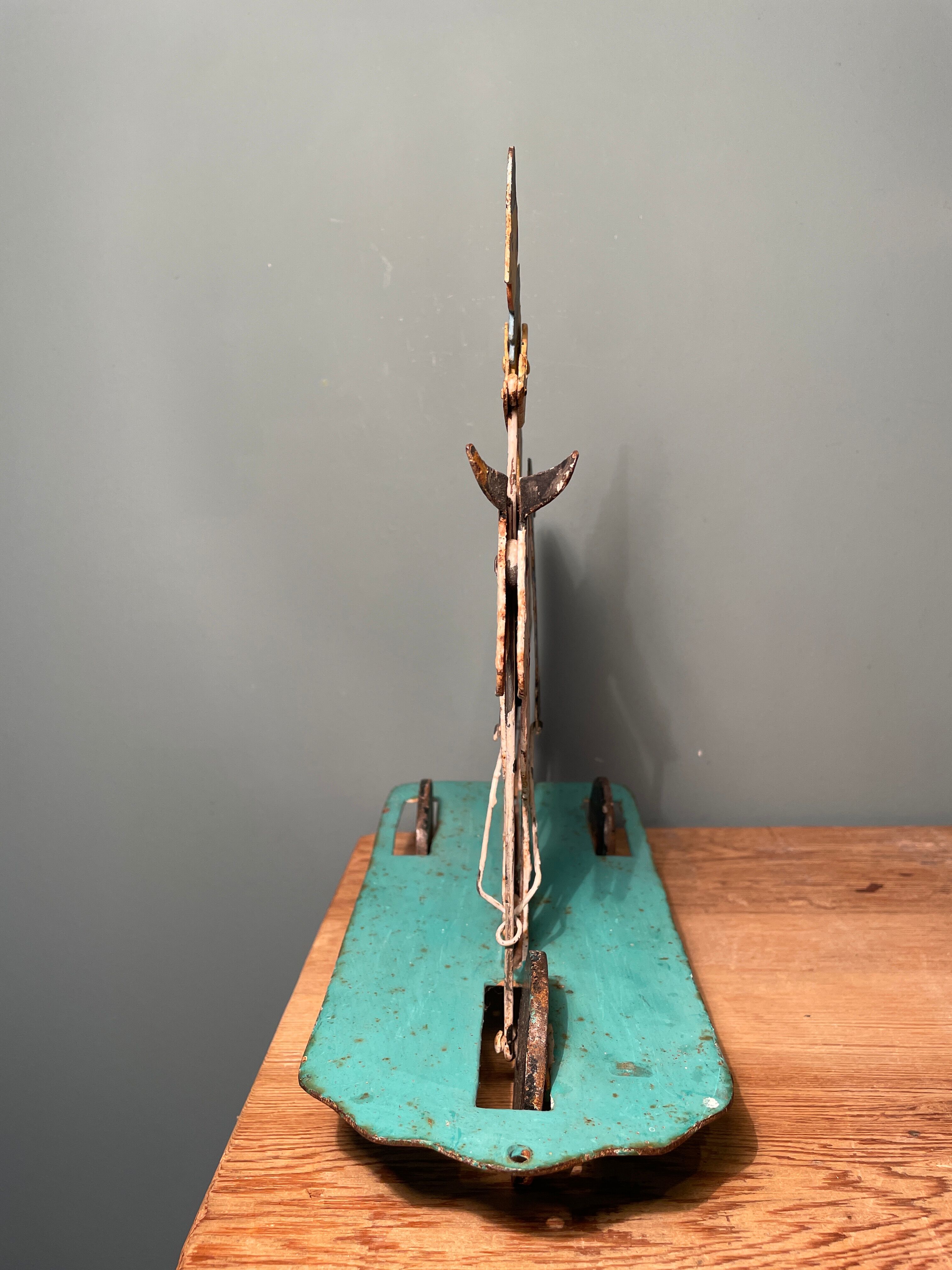 Old painted metal pulling toy