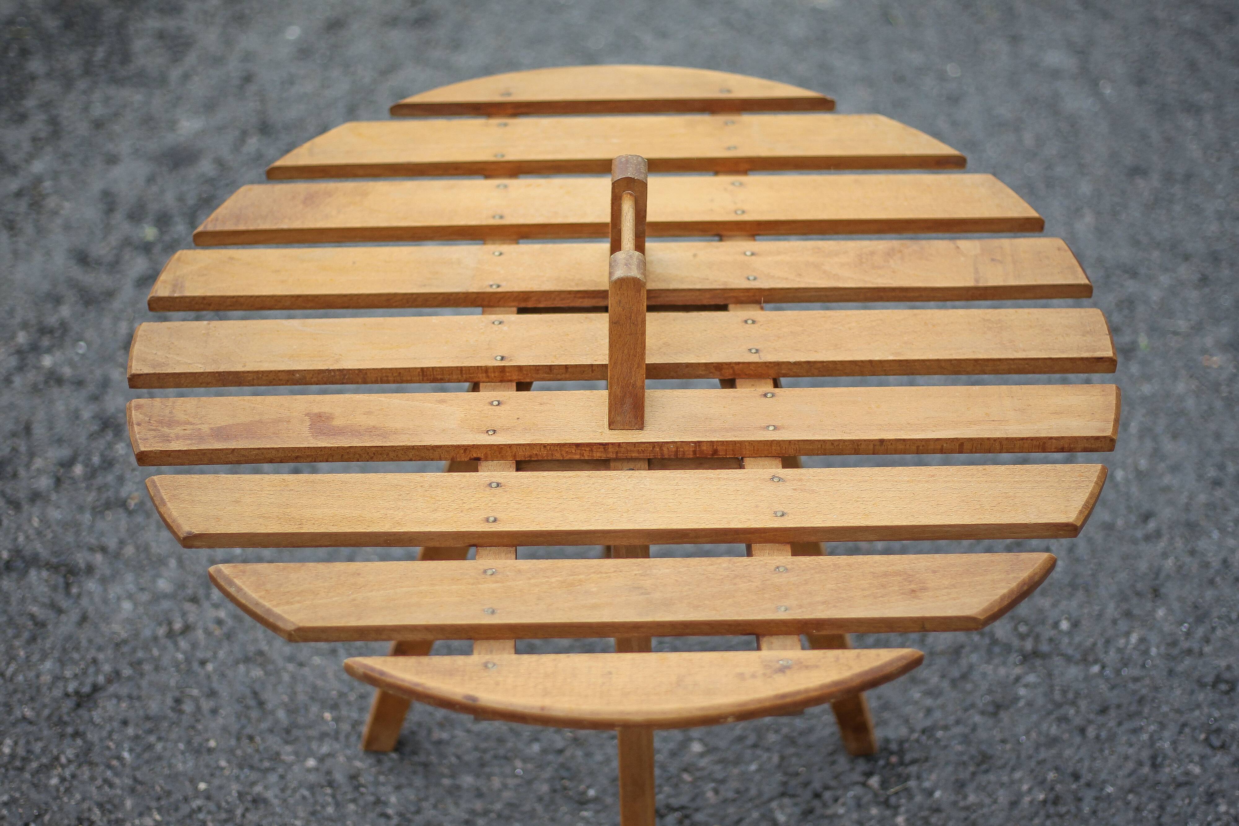 Vintage coffee table, wooden table with central handle, interior decoration, terrace, patio