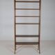 Danish freestanding wall rack with brass accents, 1960s