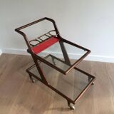 Rolling table made of wood, brass and glass