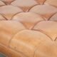 Sheepskin ottoman/coffee table on wheels in English chesterfield style