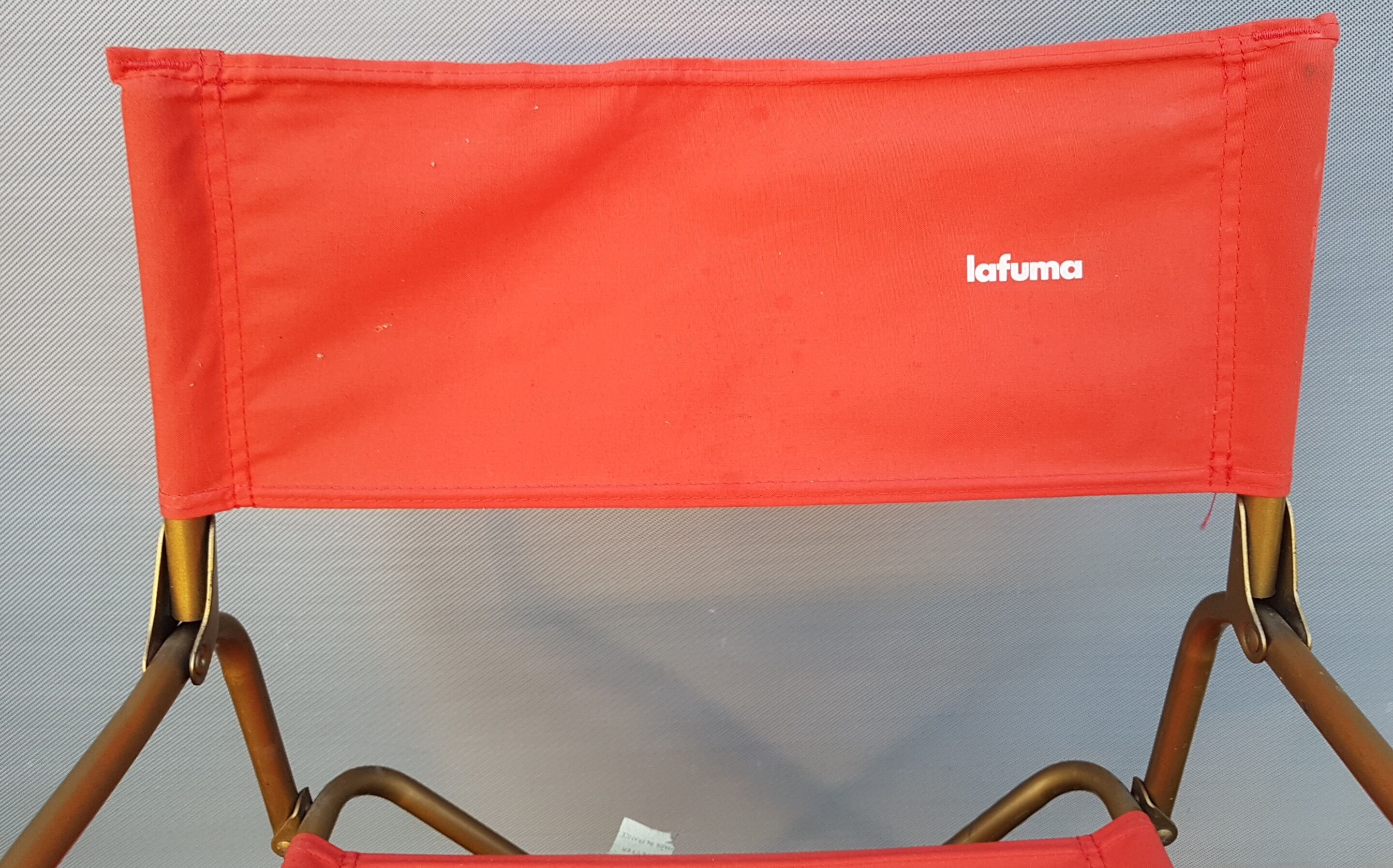 Fauteuil pliant avec accotoirs Lafuma rouge et or 1970